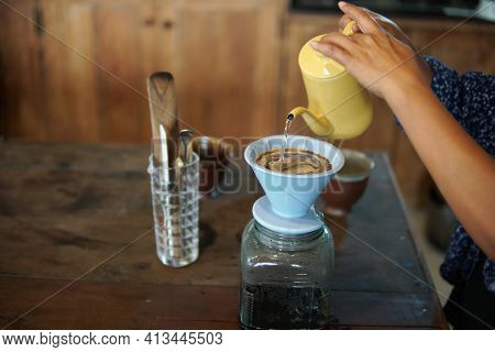 Barista Preparing Brewing Coffee With Coffee Maker And Drip Kettle.