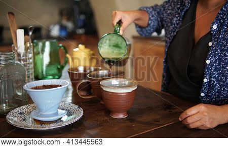 Barista Preparing Brewing Coffee With Coffee Maker And Drip Kettle.