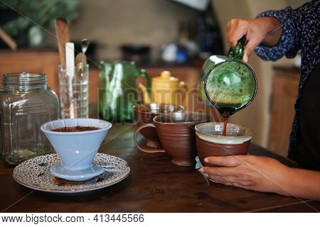 Barista Preparing Brewing Coffee With Coffee Maker And Drip Kettle.