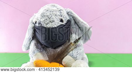 Plush Easter Rabbit Using Mask And Syringe To Fight The Covid-19