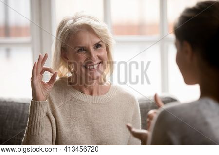 Happy Senior Woman Talk Using Sign Language