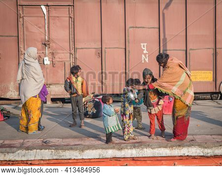 Varanasi. India. 11-02-2018. A Family Is Having Breakfast And Washing Teeth At The Varanasi Train St