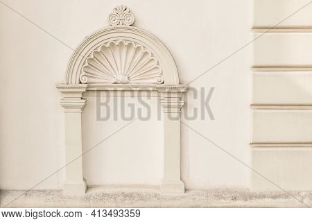 Decorative Arch And Semi Vault Above Niche With Classic Pillars. Architectural Stucco Detail Of Old 