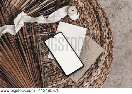 Tropical Summer Mockups. Black Cell Phone With Empty Screen, Blank Greeting Card, Envelope And Ribbo