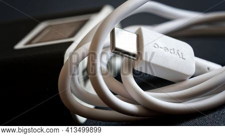 Large Power Bank With Usb Type-c Cable And Plug. Close-up. Macro. Selective Focusing