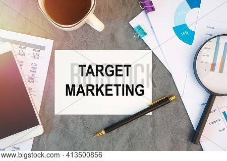 Target Marketing Is Written In A Document On The Office Desk With Office Accessories, Coffee, Diagra