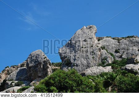 The rocky peaks of the Tramuntana mountains in the Boquer valley trail near Puerto Pollensa on the Spanish island of Majorca.