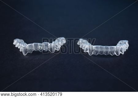 Before And After Invisalign Invisible Brackets. Two Transparent Aligner Retainers, One Initial And O