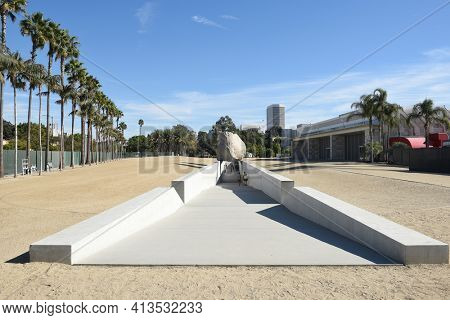 LOS ANGELES - NOVEMBER 24, 2017: Levitated Mass art installation at the Los Angeles County Museum of Art. By Michael Heizer it weighs 340 tons with a trench visitors can walk through.