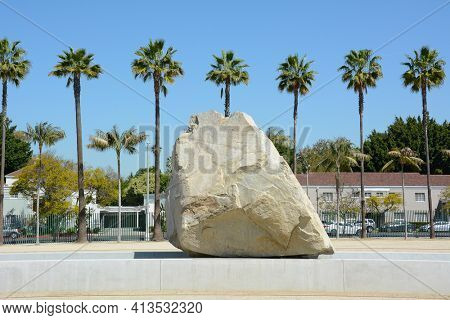 LOS ANGELES - MARCH 28, 2018: Levitated Mass art installation at the Los Angeles County Museum of Art. By Michael Heizer it weighs 340 tons with a trench visitors can walk through.
