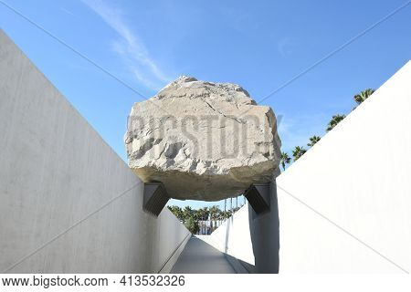 LOS ANGELES - NOVEMBER 24, 2017: Levitated Mass art installation at the Los Angeles County Museum of Art. By Michael Heizer it weighs 340 tons with a trench visitors can walk through.