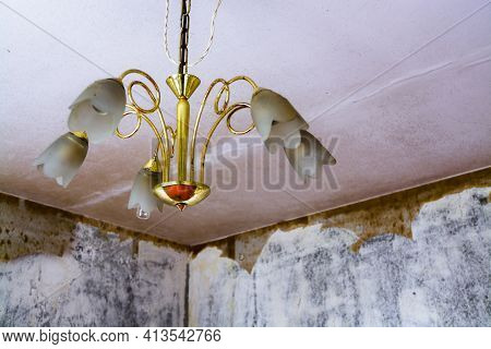 Old Chandelier In A Run-down Flat Of A Panel House