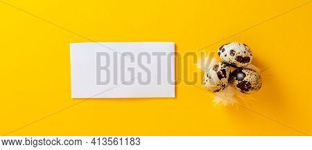 Banner With Visiting Card, Quail Eggs, Feather On Yellow Paper Background. Copy Space. Empty Text Pl
