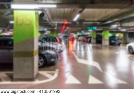 Garage Car Blurred. Car Lot Parking Space In Underground City Garage. Empty Road Asphalt Background 