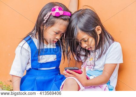 Sagada, Philippines - January 24, 2018: Young Girls With A Smartphone In Sagada Village On Luzon Isl
