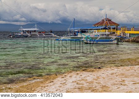 Moalboal, Philippines - February 13, 2018: Various Boats Off Coast In Moalboal, Cebu Island, Philipp
