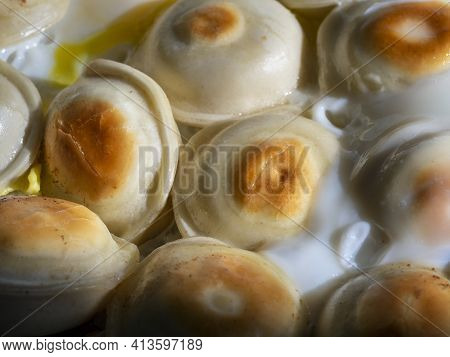 Delicious Round Fried Dumplings With Scrambled Eggs Close-up. Food Background With Homemade Dumpling