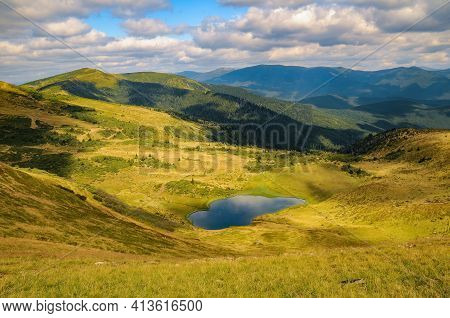 Scenic View Of Apshynets Glacial Lake And Svydovets Mountain Range At Sunny Summer Day. Amazing Summ