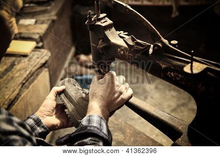 cobbler at work with sewing machine