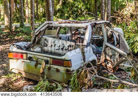 Old Rusty Car In A Forest Near Loboc Village On Bohol Island, Philippin