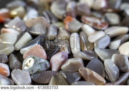 Macroshooting Of Natural Mineral Rock Specimen - Tumbled Green Aventurine Gemstone On White Backgrou