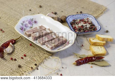 Homemade Brawn Headcheese Meat Product Saltison On Rough Linen Cloth With Sea Salt And Spices Top Vi