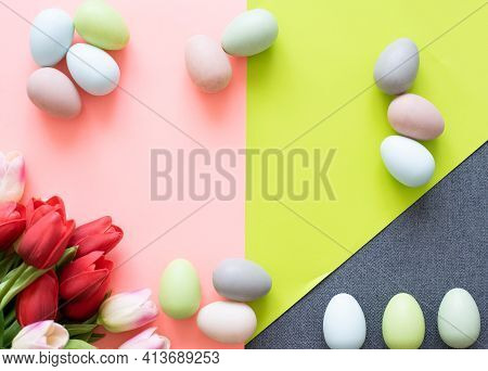 Easter Eggs And Tulips On Light Green Background