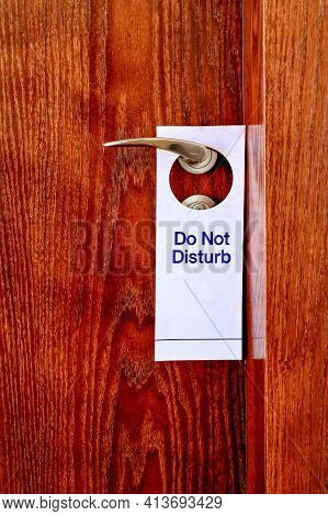 Do Not Disturb Sign Hang On Door Knob. Do No Disturb Sign At Hotel Room Door. Close-up