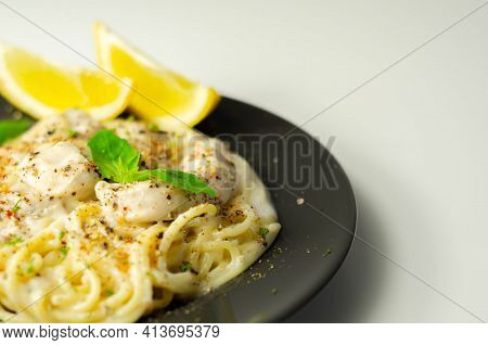 Carbonara, Spaghetti With A Cheese And Smoked Bacon Sauce Topped With Chicken Breast Pieces And Rega