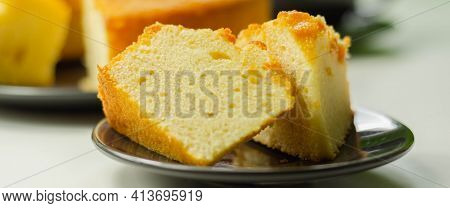Portion Of Madeira Ring Loaf Cake Served On A Small Plate