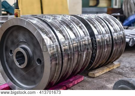 Wheelsets After Production On A Wooden Rack In A Warehouse. Production Of Wheels For Trains And Wago