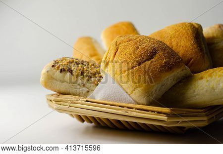 Various Types Of Bread Served On A Wicker Tray, Delicious And Fresh Rolls