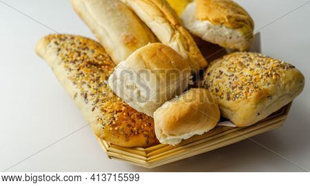 Various Types Of Bread Served On A Wicker Tray, Delicious And Fresh Rolls