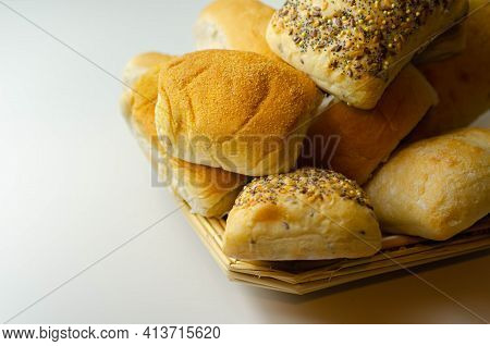 Various Types Of Bread Served On A Wicker Tray, Delicious And Fresh Rolls
