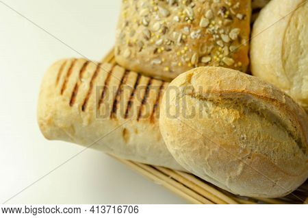 Various Types Of Bread Served On A Wicker Tray, Delicious And Fresh Rolls