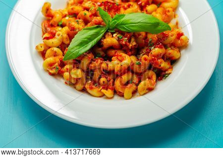Cooked Cellentani Pasta With Cooked Chicken Breast And Peppers In A Spicy Tomato And Jalapeno Dressi