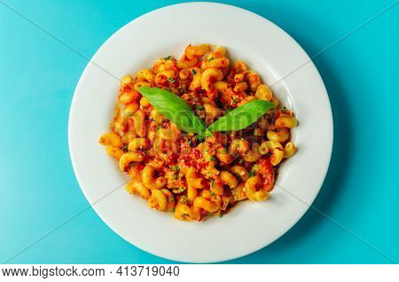 Cooked Cellentani Pasta With Cooked Chicken Breast And Peppers In A Spicy Tomato And Jalapeno Dressi