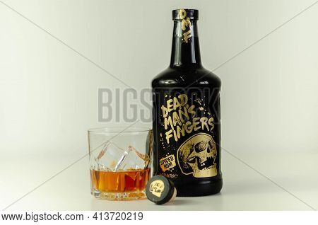 London, United Kingdom - August 04, 2020 A Glass With Spiced Rum Called Dead Man's Fingers And Ice C