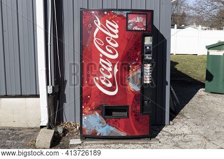 Muncie - Circa March 2021: Coca-cola Vending Machine. Coca-cola Manufactures Coke, Diet Coke, Sprite