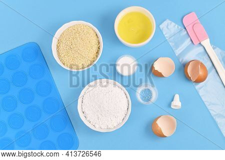 Ingredients For Making Homemade French Macarons Sweets Including Powdered Sugar, Ground Almonds, Egg