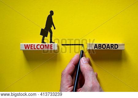 Welcome Aboard Symbol. Wooden Blocks With Words 'welcome Aboard'. Businessman Hand. Beautiful Yellow