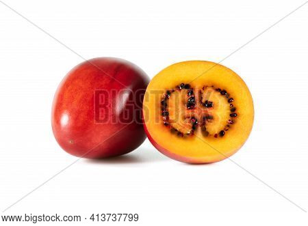 Tamarillo Fruit Isolated On A White Background. Juicy Sliced Tamarillo. Fresh Ripe Fruit.