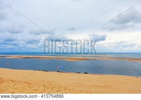 Paragliding At Atlantic Ocean Coast . Scenery Of Banc D'arguin Island Of Atlantic Littoral . Beautif