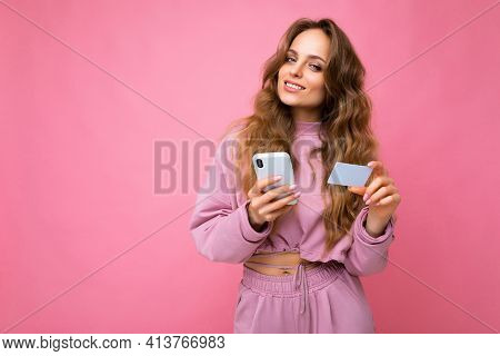 Photo Of Attractive Positive Smiling Young Blonde Curly Female Peson Wearing Pink Clothes Isolated O