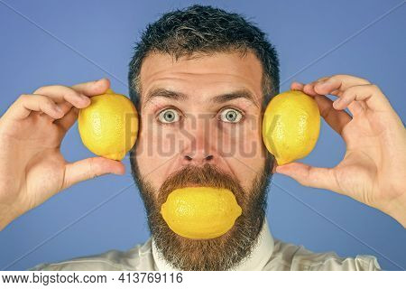 Man Eat Lemon. Fruit And Healthy Organic Food. Fynny Citrus Fruit.