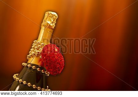 A Holiday Card.a Bottle Of Champagne On A Brown Background. Copyspace