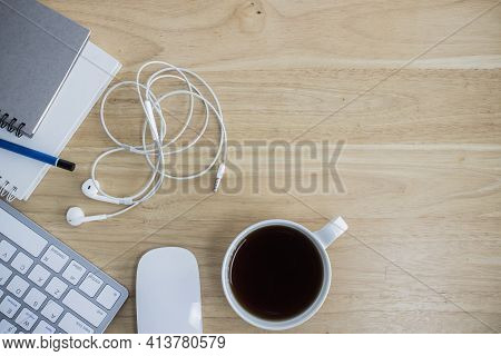 Workplace With Notebook And Keyboard, Mouse On Wooden Table