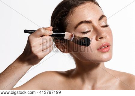 Beauty Girl Apply Face Mask From Acne On The Face With Make Up Brush To Rejuvenate Skin. Cosmetology