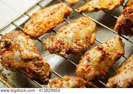 Raw Chicken Wings With A Rendang Style Rub Made With Chilli And Garlic On The Grill Tray, Asian Food