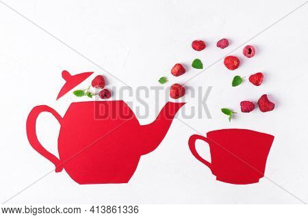 Creative Flat Lay With Strawberry, Raspberry And Mint Flying Into The Red Cardboard Cup Out Of The T